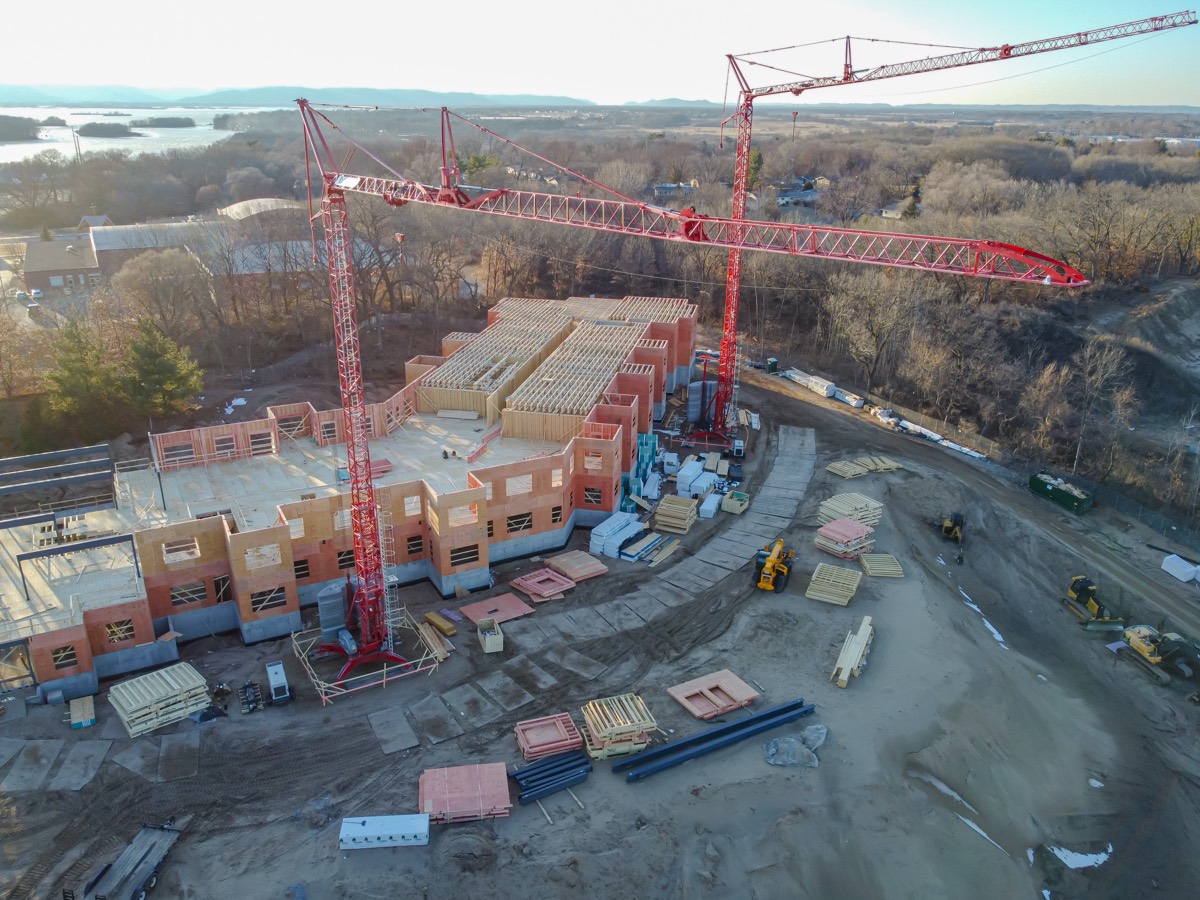 Aerial view of a construction site with tower cranes